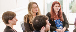 Four people in silent worship at the Quaker Welcome Cente