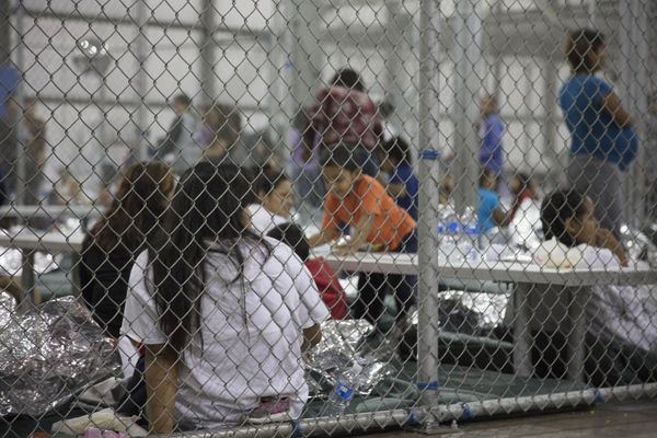 U.S. Border Patrol agents conduct intake at the Central Processing Center in McAllen, Texas, Sunday, June 17, 2018.