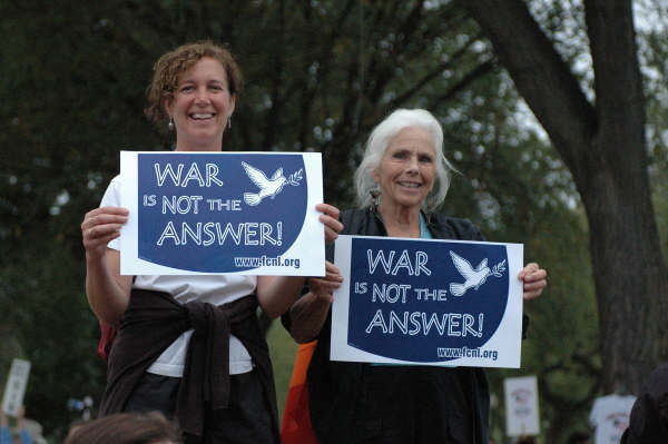Advocates holding signs that say War is Not the Answer
